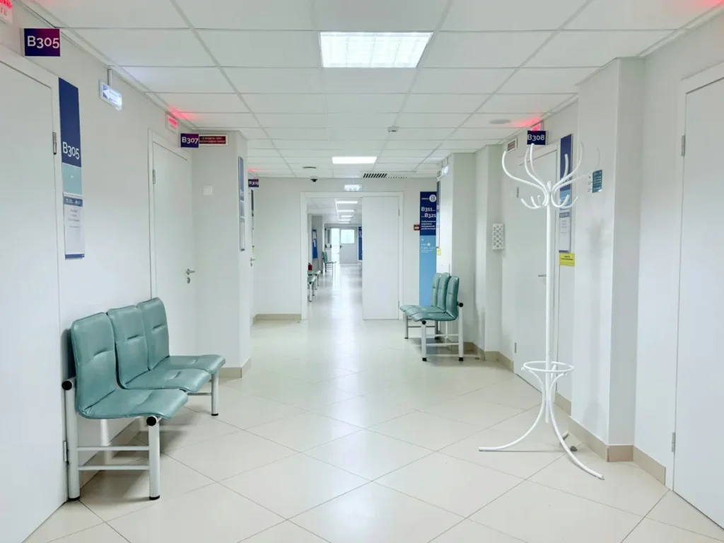 Clean medical office hallway with waiting-area benches