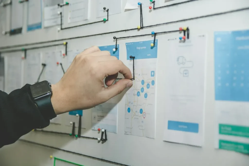 Manager planning an office cleaning schedule on a wall board