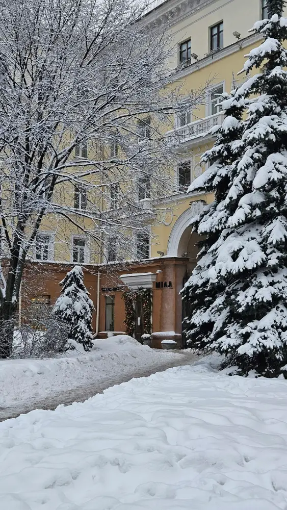 Snow-covered commercial building entrance in winter, where snow and salt get tracked inside